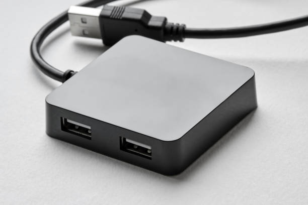 istock Black portable USB hub for four connections on a white background. Bus povered. Closeup, selective focus 1271293096