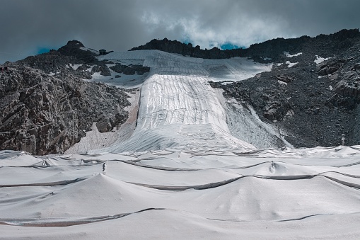 Presena Glacier covered with a plastic sheet to prevent the glacier from melting in summer (Alps, Trentino, Italy, Europe)