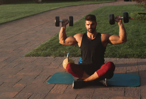 istock Muscular young man exercising in backyard 1271295237