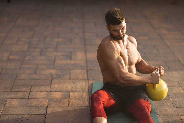 istock Muscular young man exercising in backyard 1271295519