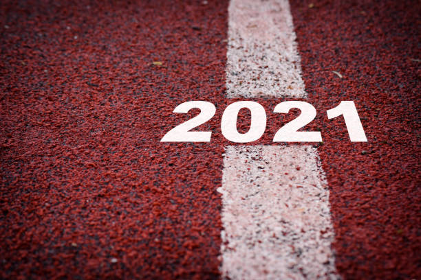 istock New year 2021 on running race surface with marking lines 1271296899