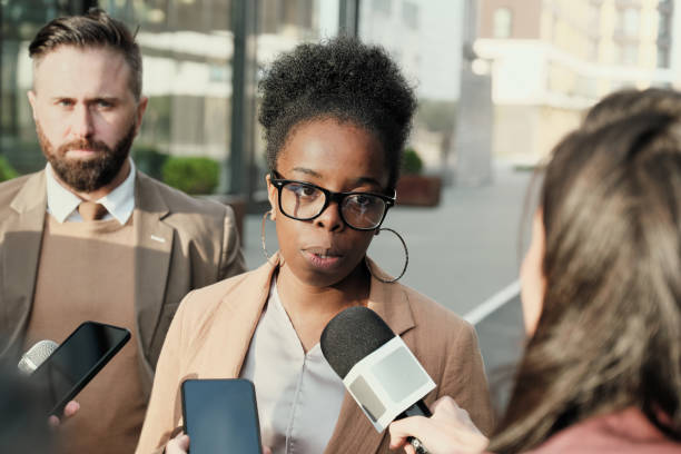 istock Woman being interviewed outdoors 1271297101