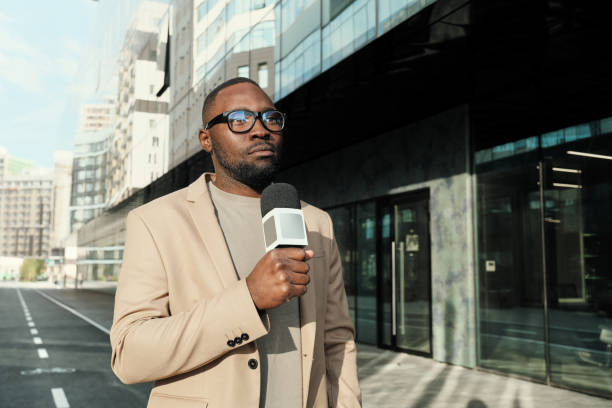 istock African reporter working outdoors 1271297124