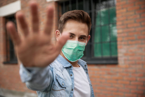 istock Young man telling you to stop spreading the virus 1271302396