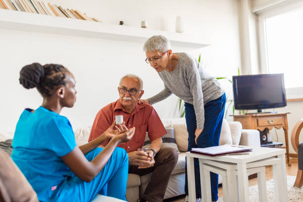 istock Nurse in the home visit helping senior couple 1271304479
