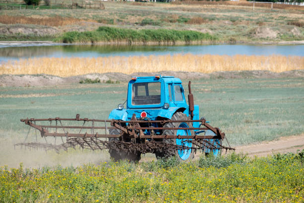 old tractor with harrow - agricultural machinery retro revival summer farm imagens e fotografias de stock