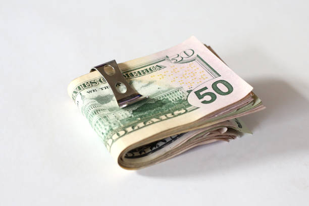 istock A clip of Dollar money notes. 1271307552