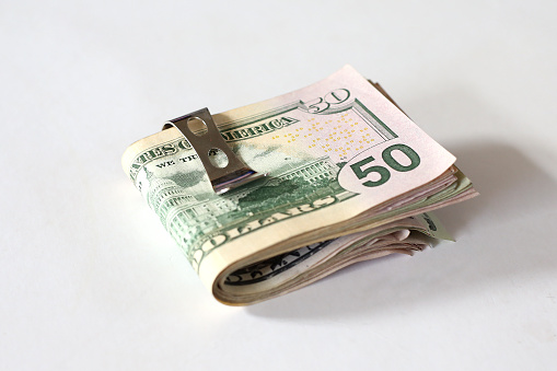 A money clip with $50 notes
