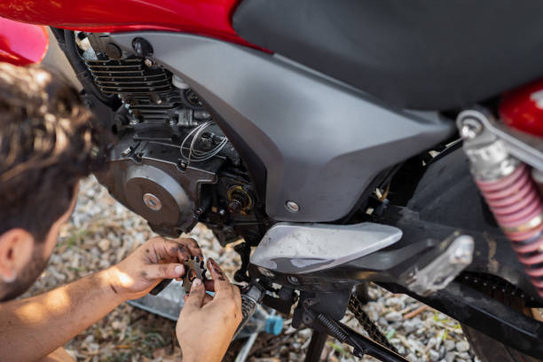 istock Man repairs his motorbike 1271307711