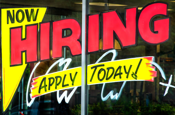 istock Now hiring apply today sign painted on business window 1271307908