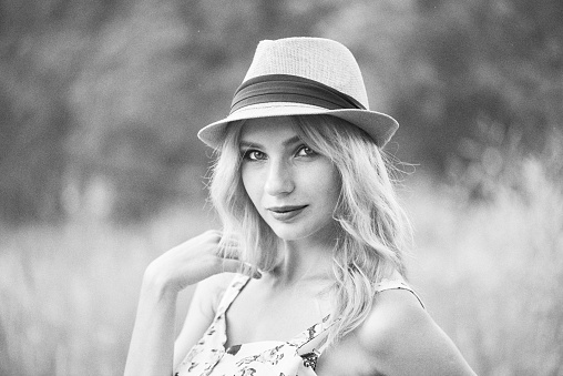 Carefree blond woman outdoors. Black and White.  Add noice.