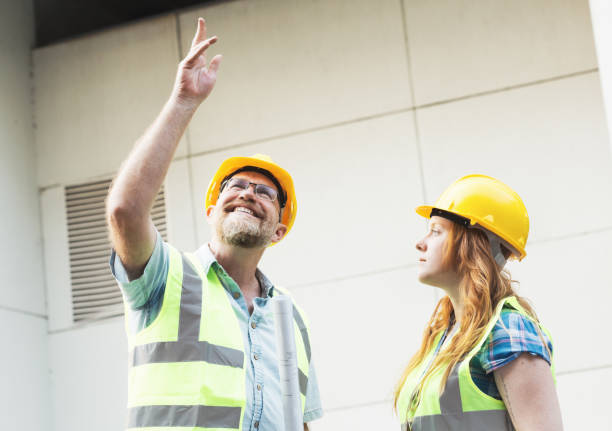 istock Two architect, civil engineer or building contractor colleagues on a construction site 1271312213