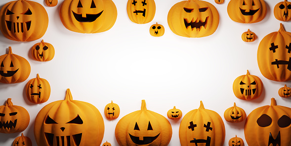 Halloween pumpkins on white background with empty space. Jack-o'-lantern scary carved face.
