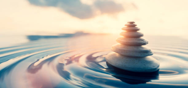 istock Mindfulness and meditation zen rocks on water 1271313562