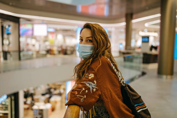 istock Young woman shopping during COVID 1271314361