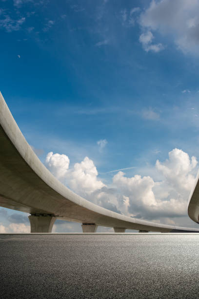 istock Clear sky, highway pavement under the overpass 1271315696