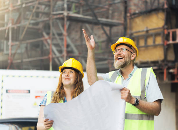 istock Two architect, civil engineer or building contractor colleagues on a construction site 1271318242