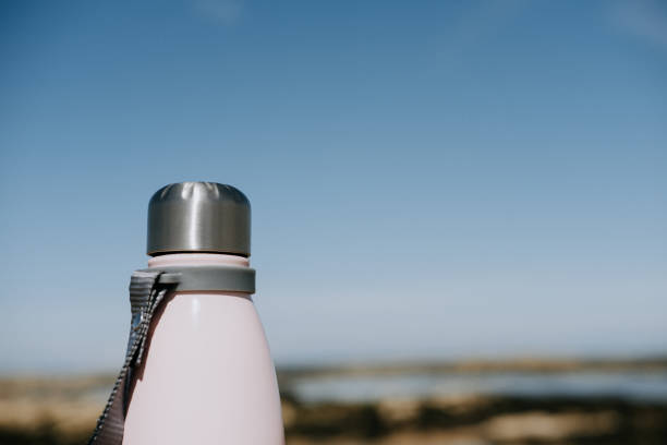 istock pink insulated drink container in the sand 1271319553