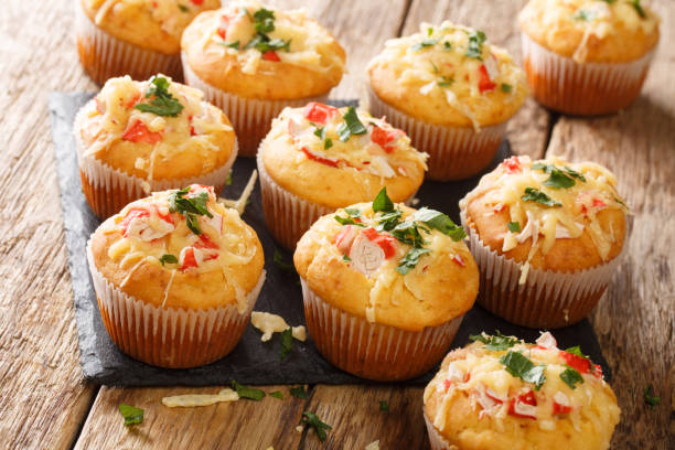 istock Delicious corn muffins stuffed with seafood herbs and cheese close-up on a slate board. horizontal 1271320188