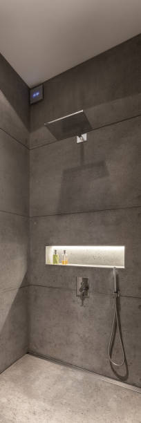 istock Concrete wall tiles in shower, panorama 1271320361