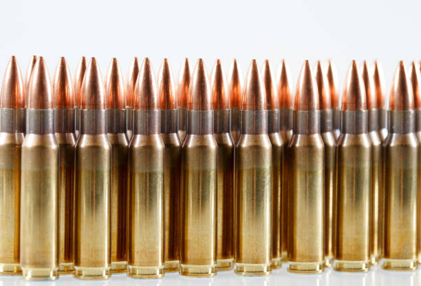 Hunting cartridges of caliber on a white background. 308 Win Hunting cartridges of caliber 308 Win ak 47 bullets stock pictures, royalty-free photos & images
