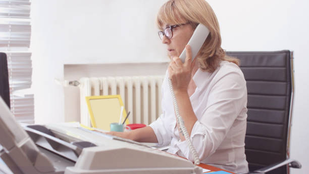 istock Mature Woman Librarian at her work 1271320877