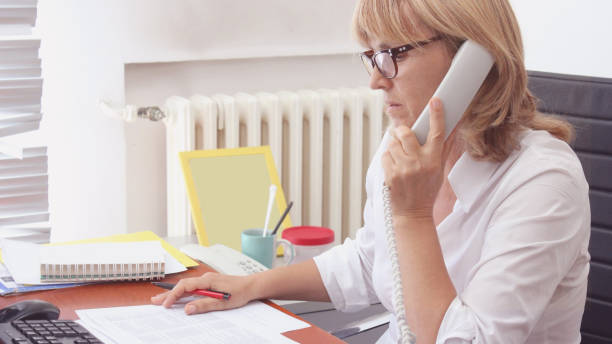 istock Mature Woman Librarian at her work 1271320881