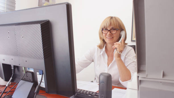istock Mature Woman Librarian at her work 1271320886