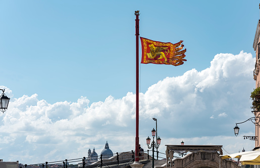 Red and gold flag depicting a winged lion, symbol of the great maritime republic of Venice.