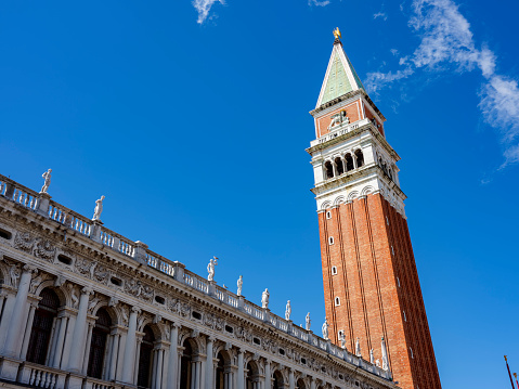 Glimpse of Piazza San Marco with the historic bell tower in Venice, Italy.
