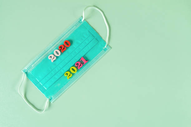 istock 2020 and 2021 year on medical face mask 1271327014