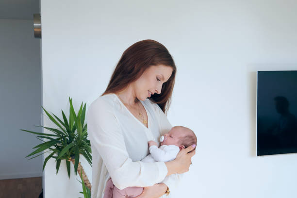 istock Young mother holding a baby 1271327169