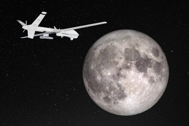 silhouette of unmanned aerial vehicle (uav) flying against background of huge full moon in dark starry space. elements of this image furnished by nasa - full moon audio imagens e fotografias de stock