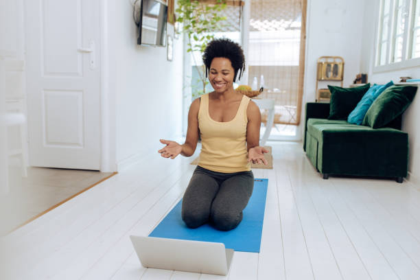 istock African-American yoga instructor starting her online session 1271330646