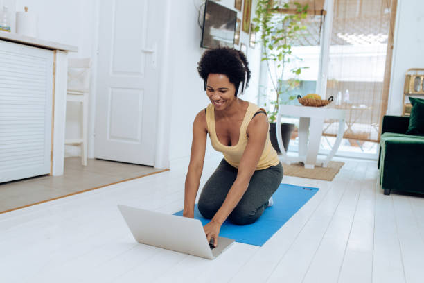 istock African-American yoga instructor preparing for her online class 1271330690