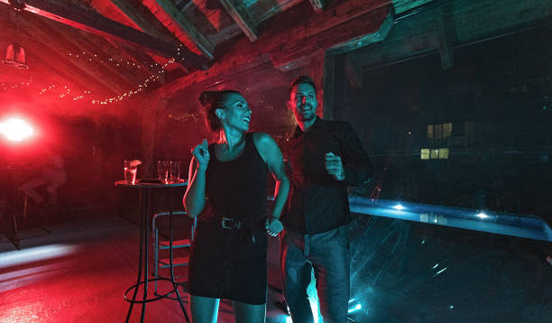 istock Happy couple dancing in club 1271330861