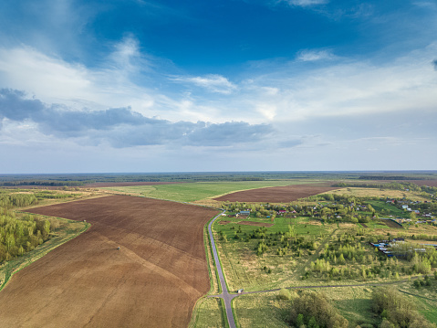 Drone air view of the rural terrain at summer day.