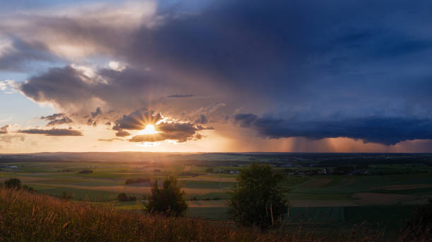 istock Sun and storm on the field 1271332053