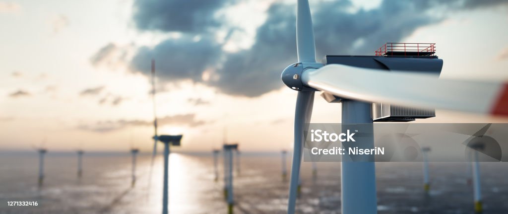 Offshore wind power and energy farm with many wind turbines on the ocean Offshore wind power and energy farm with many wind turbines on the ocean. Sustainable electricity production Wind Turbine Stock Photo
