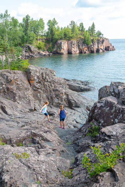 istock Girls Exploring Rocky Cliffs on Lake Superior's North Shore 1271333595