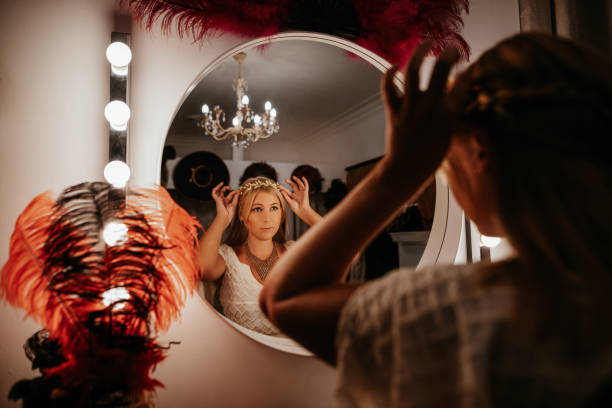 istock Theatre actress backstage in front of the mirrow 1271334112