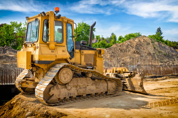 istock Yellow bulldozer in construction of highway 1271335355