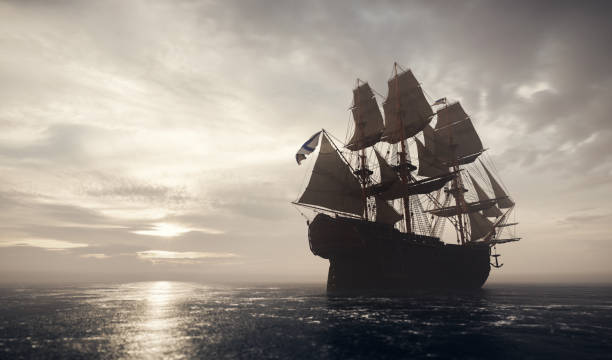 istock Pirate ship sailing on the ocean. Stormy clouds 1271335692