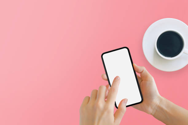 istock Black smartphone with white blank screen in hand. 1271336666