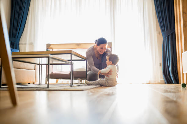 istock Mother and her baby boy playing 1271337392