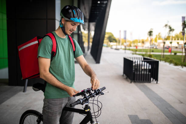 istock Delivery person using mobile phone to locate next customer 1271339743
