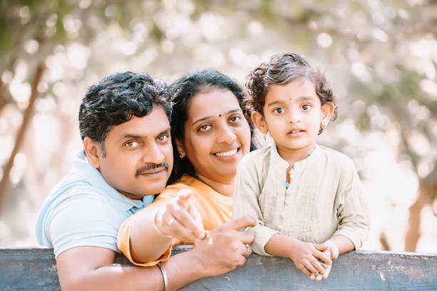 istock Family has fun playing in the park 1271342357