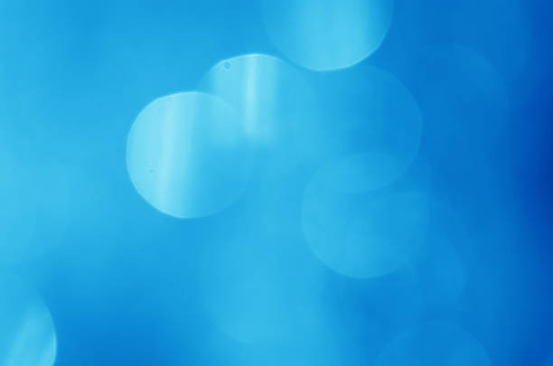 istock glitter light sparkle blue gorgeous bokeh defocused abstract background shiny. 1271344593