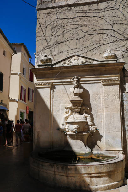 fountain dedicated to Nostradamus in Saint remy de Provence fountain dedicated to Nostradamus in Saint remy de Provence, France nostradamus stock pictures, royalty-free photos & images