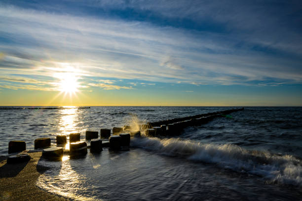 istock Sunset with clouds by the sea 1271349326